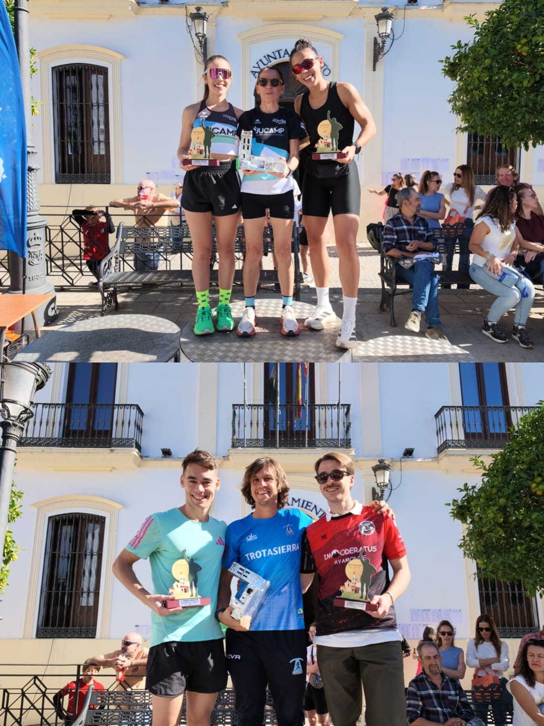 Tres corredoras y tres corredores posan por separado con trofeos ante la fachada de un edificio con público sentado.